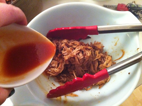 Adding the homemade BBQ Sauce to a portion