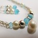 http://www.etsy.com/listing/71777467/elegant-pearl-and-turquoise-glass-bead?ref=v1_other_1