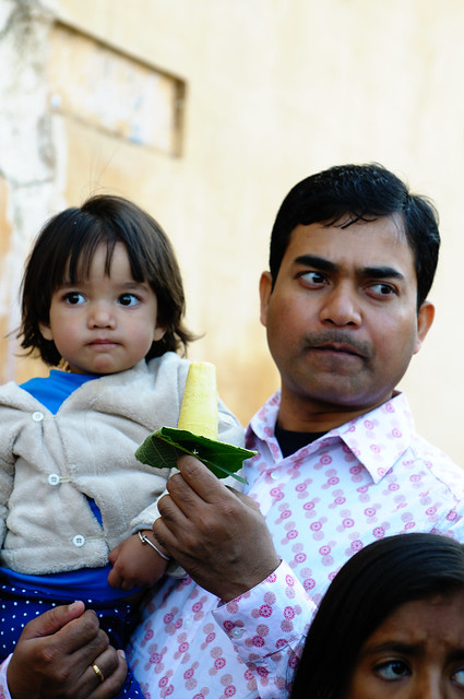 Man and Child eating kulfi