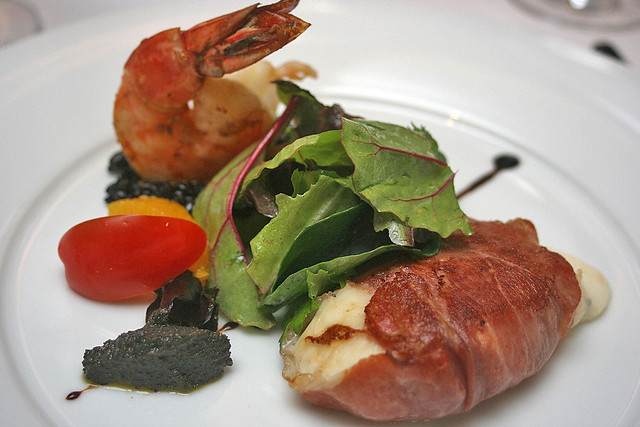 Antipasti - Pan-fried Buffalo Mozzarella wrapped in Parma Ham served with black Olives Tapenade