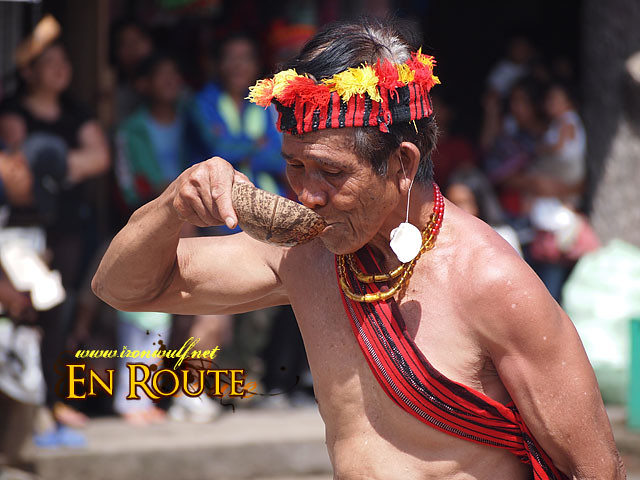 An elder drink Rice Wine during the performance
