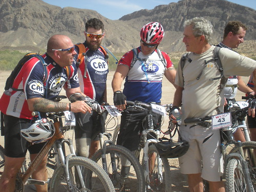 President Bush talks with some warriors after the ride on Day One