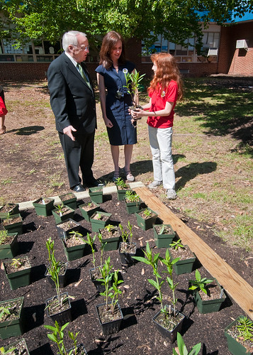 Dr. Kevin Concannon (left), Undersecretary, Food Consumer and Nutrition Services,  Dr. Elizabeth Hagen (center), Undersecretary, Food Safety and Emily Wise (right), a fifth grade student at Maryland City Elementary School in Laurel, MD, discuss the plants native to Maryland that will be going into the school garden. Undersecretary Concannon and Undersecretary Hagen were at Maryland City Elementary for the USDA, Food Safety Inspection Service, Food Safety Education Camp on Thursday, May 5, 2011. USDA Photo by  Bob Nichols. 