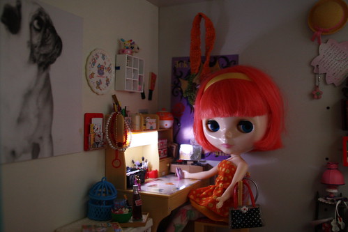 Bambi by her desk, about to make a phone call