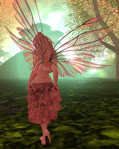 Picture Description: Faerie in Mauve, her back to the camera, walking toward a green-lit set of hills.