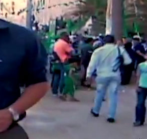 Men with automatic weapons provide security at June 17th Qaddafi rally