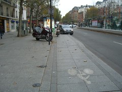 Car parked on a bicycle path