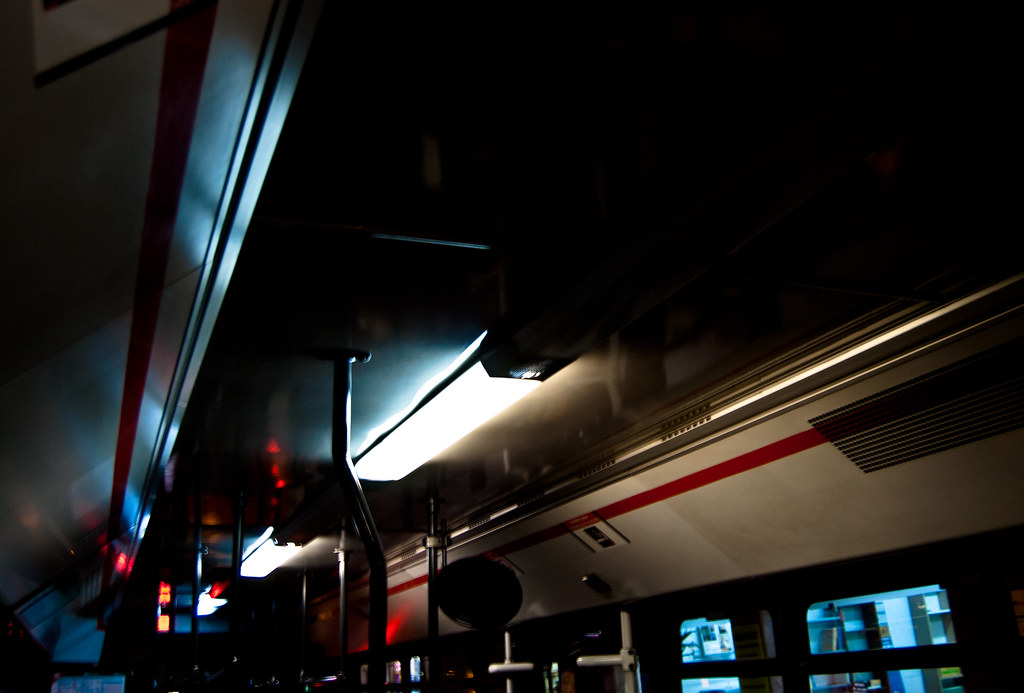 Inside of one of Barcelona's public buses. I like the cold light and red lines in this picture.