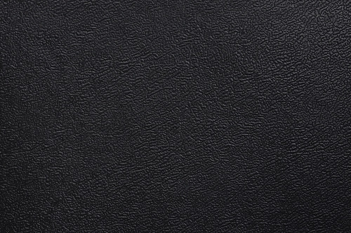 Close-up of black fake leather texture