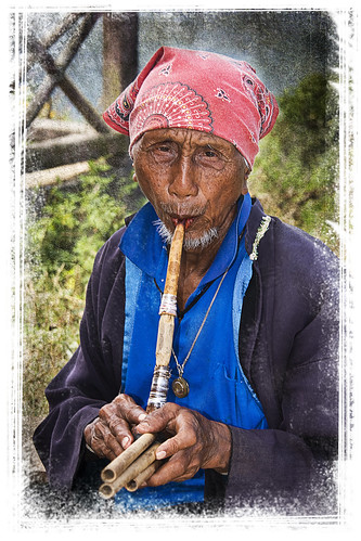 Lahu hill tribesman playing pipes