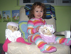 toddler in pajamas with two teddybears sporting underwear hats and shirts...