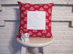 red and turquoise elephant pillow