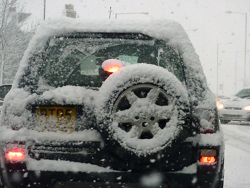 Snowy car before us