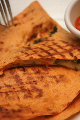 Grilled Mediterranean Quesadillas: Melted Monterey Jack cheese and vegetables sandwiched in warm tortilla; served with a tomato-cilantro salsa