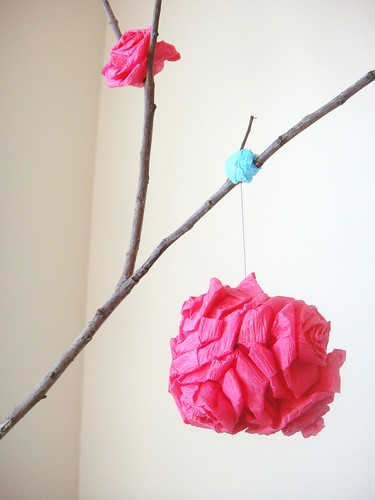 Crepe paper rose pomander on tree