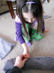 Peanut sews the rolled sweater