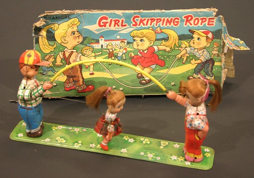 Girl Skipping Rope - a Japanese clockwork mechanical toy (est £25 to £35)