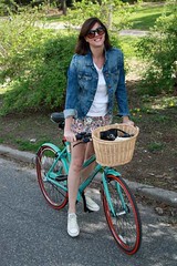 girl on red stripe bike