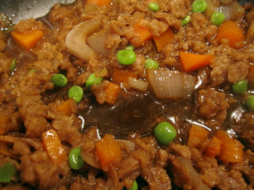 fake beef crumbles stewing in beer