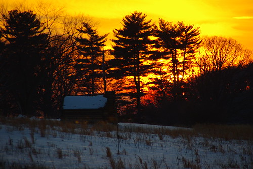 A winter's sunset over a cabin at Valley Forge