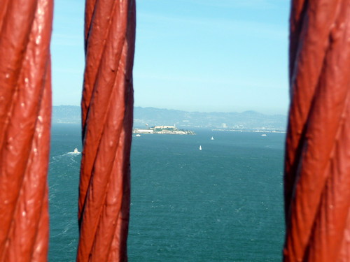 Alcatraz Island viewed from red Golden Gate Bridge cables, San Francisco, California, Western United States of America