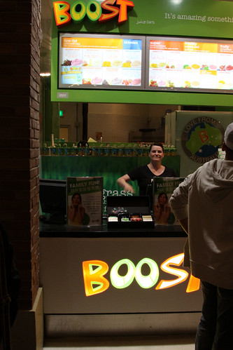 A smiling Western face at a Boost Juice store
