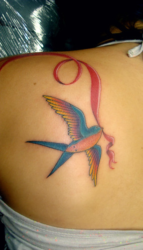 Swallow bird tattoo on upper left back girls tattoo designs of birds