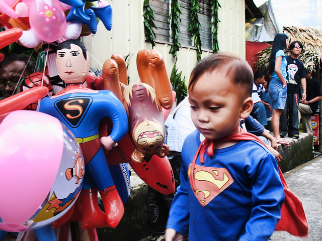 superman kid and toy at Lucban, Quezon during Pahiyas
