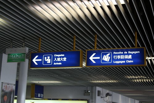 Signage at the Macau ferry terminal: in Portuguese, Chinese and English