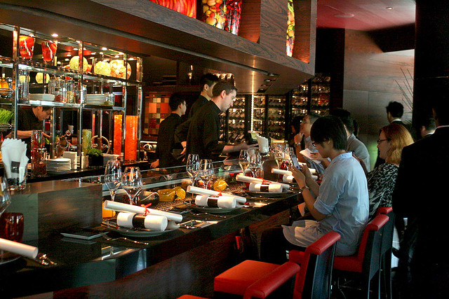 L'Atelier de Joël Robuchon seats 28 around its counter and 24 at tables