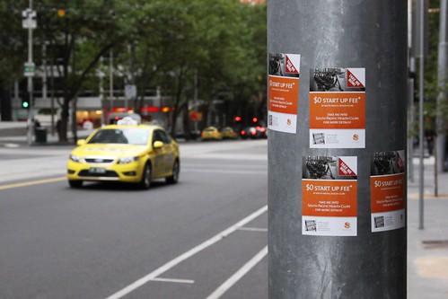 Pole covered in South Pacific Health Clubs advertising