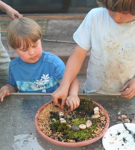 Dish Garden in Progress: Lucas Making a Stone Spiral