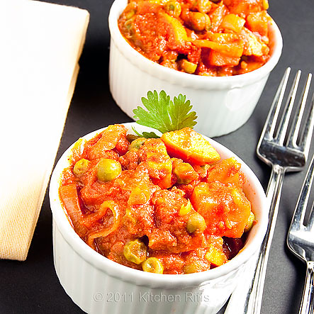 Vegan sweet potato curry in tomato sauce in two ramekins