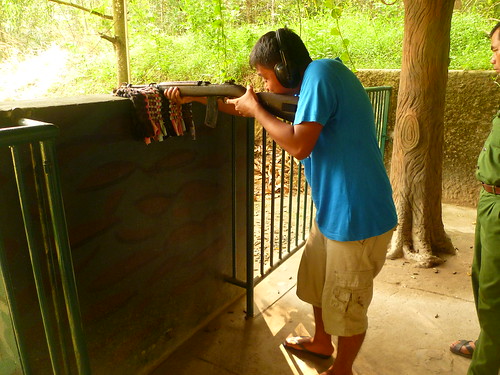 Shooting a rifle in Cu Chi Tunnels in Vietnam