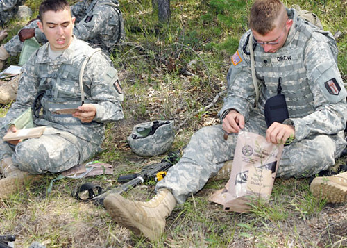 090814-3834S-5553. Members of the 338th Engineer Company test Meals, Ready-to-Eat at a Fort McCoy training site on South Post as part of a Natick Soldier Research project at Fort McCoy Aug. 14. Photo by Rob Schuette, PAO, Fort McCoy, WI. Publication or commercial use of this material requires release by a U.S. Army Public Affairs Officer. Credit U.S. Army photograph. 