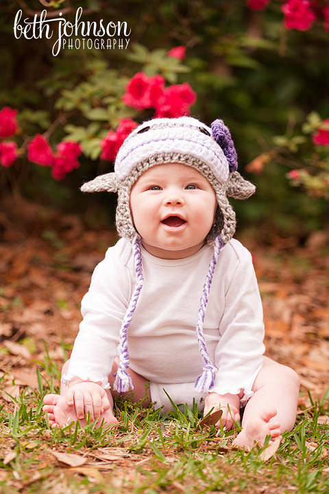 six month old baby in a cute monkey hat