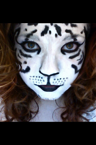 black and white tiger face. A girl with a white tiger face