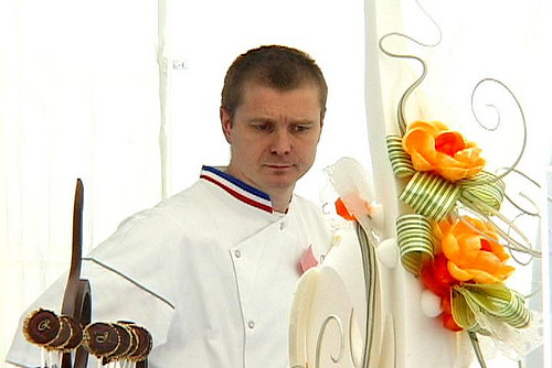 Chef Canonne surveys Chef Jacquy Pfeiffer's final buffet