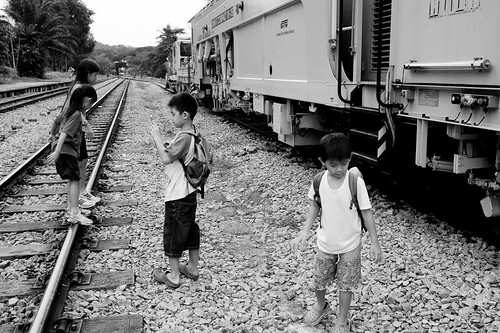 Kids playing alongside a maintenance train at Bukit Timah Railway Station