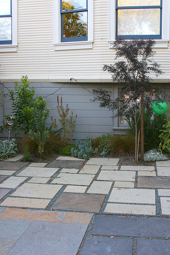 ecclectic patio and interesting plantings