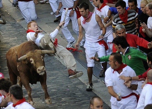 Sun, sangria and a sea of red... as Pamplona prepares for another gorefest at the running of the bulls  7