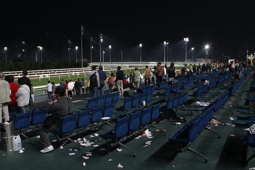 Home time, abandoned betting slips cover the ground