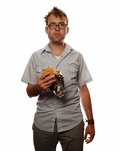 Impromptu Portrait of a Young Man consuming a Hamburger