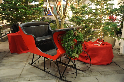 Santa's sled, red and black with Christmas wreath, trees, Seattle, Washington, USA by Wonderlane