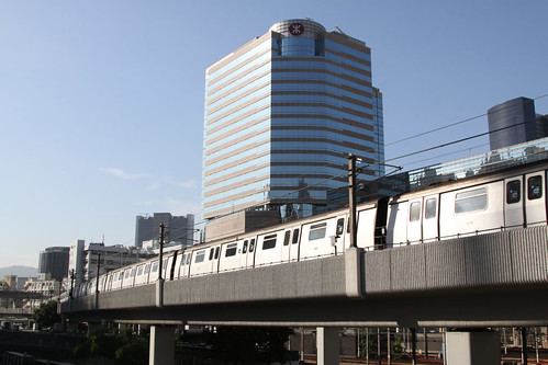 Train passing the MTR headquarters at Kowloon Bay