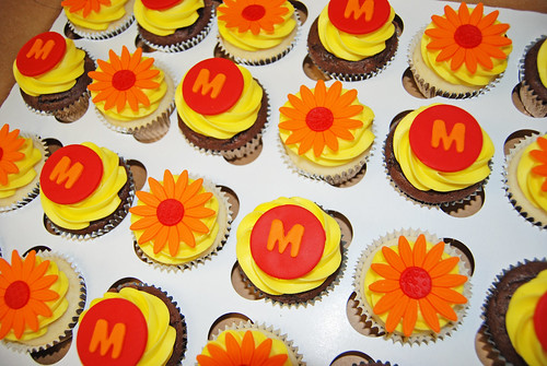 Red and Orange daisy and monogram cupcakes