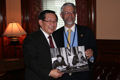 OSTP Director John P. Holdren and the Minister of Science and Technology for the People’s Republic of China Wan Gang hold a photograph of U.S. President Jimmy Carter and Chinese Premier Deng Xiaoping signing the original U.S.-China Agreement on Cooperation in Science and Technology in 1979.