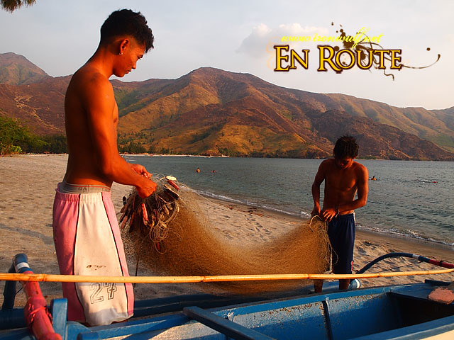 Young fishermen tending their nets