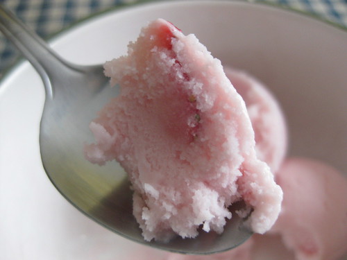 Homemade strawberry frozen yogurt, with fresh strawberry pieces