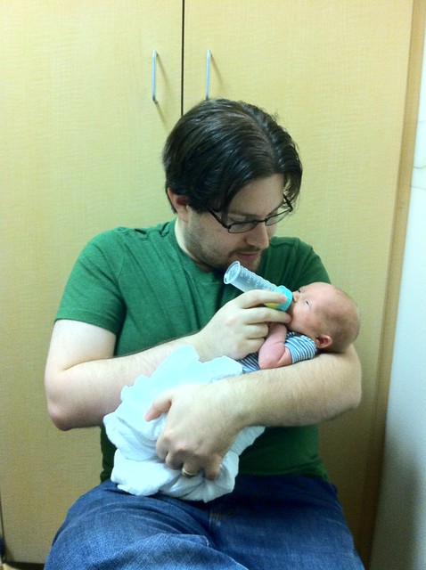 Had a very lengthy visit with a lactation consultant. Rob got to feed the baby some liquid gold with his first bottle ever.